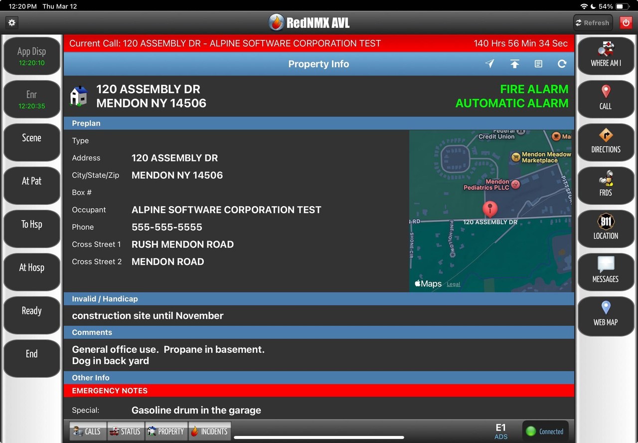 RedAlert MDT property and preplan screen on an apparatus tablet, showing the incident address, occupancy hazards, cross streets, and a map en route to a fire alarm