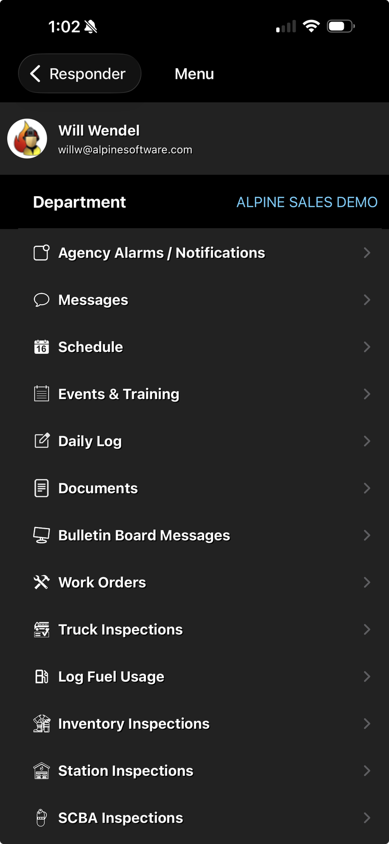 RedAlert Mobile main menu on a phone, listing department tools including messages, schedule, events, truck inspections, and SCBA inspections